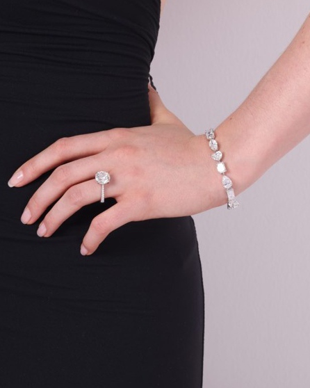 Model wearing a diamond ring and bracelet
